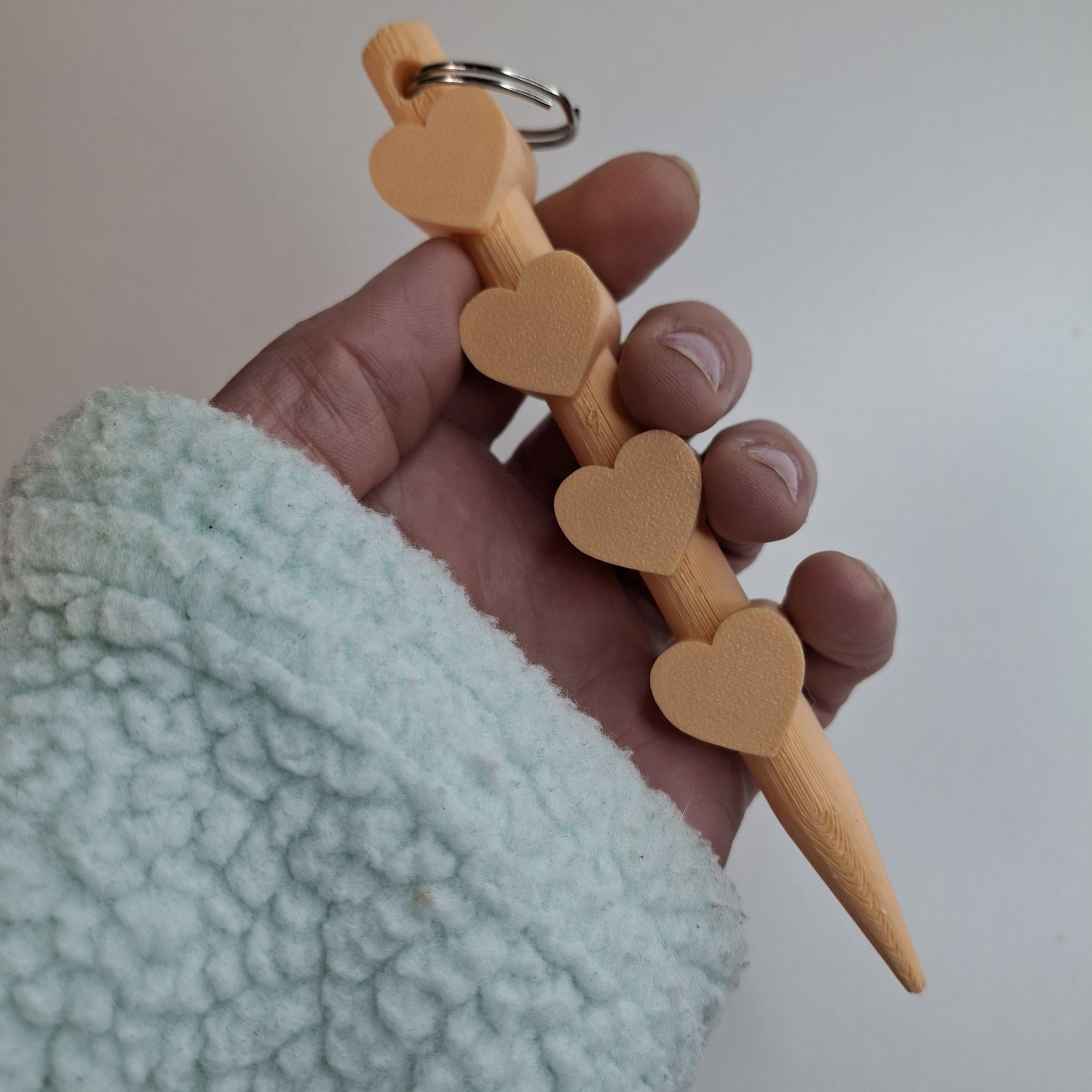 3D geprinte kubotan sleutelhanger in perzik kleur